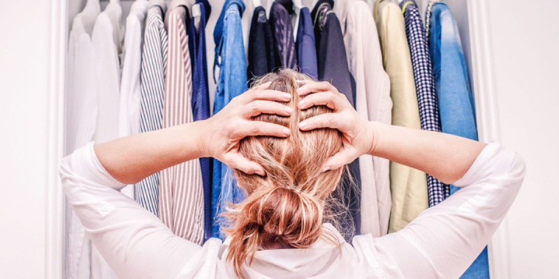 Woman Starring At Her Wardrope In A Confusing Mind.